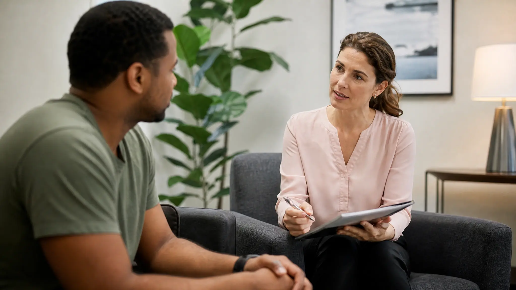 Patient reviewing an evidence-based addiction treatment plan with a therapist.